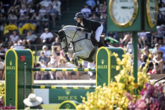 Martin Fuchs of Switzerland and riding Leone Jei compete in the first round of the 1.60m CPKC
