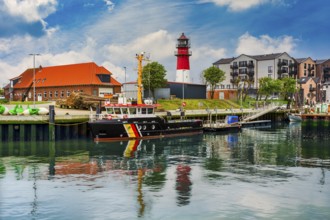 Lighthouse and harbour, ships at the pier, North Sea, Büsum, Schleswig-Holstein, Germany