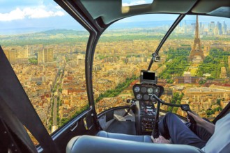 Helicopter cockpit aerial view of Tour Eiffel in Paris, French capital, Europe. Scenic flight above