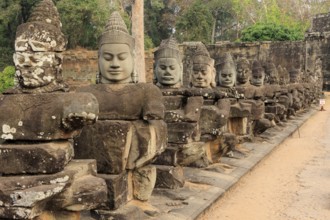 Balustrade with stone gods and demons on the bridge to the southern Tor tor of Angkor Thom