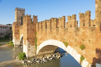 Verona, Italy. Castelvecchio bridge on Adige river. Old castle sightseeing at sunrise