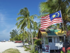 Beach hut with flag, on the sandy beach, Chenang Beach, Langkawi, Kedah State, Malaysia, Southeast