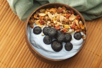 Healthy breakfast concept with flakes, blue spirulina and fresh berries