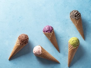 Various ice cream scoops in cones with copy space. Colorful ice cream in cones chocolate,