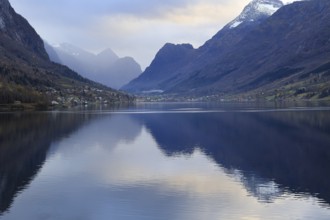 View of the Innvikfjorden near Loen in Norway. The landscape is reflected in the water