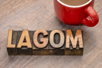 Lagom word abstract in vintage letterpress wood type blocks, Swedish balanced lifestyle concept