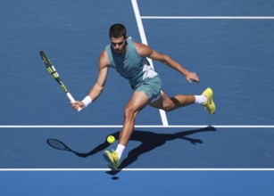 Spanish tennis player Carlos Alcaraz (ESP) playing forehand shot at Australian Open 2025
