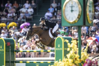 Jana Wargers of Germany and riding Dorette Old compete in the first round of the 1.60m CPKC