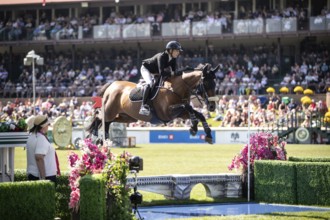 Katie Laurie of Australia and riding Django II compete in the first round of the 1.60m CPKC