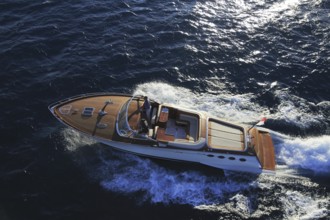 Aerial view sports boat J Craft 42 Torpedo R at full speed on the Cote d'Azur, luxurious motorboat
