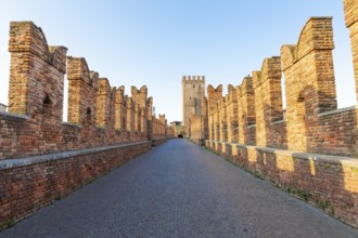 Verona, Italy. Castelvecchio bridge on Adige river. Old castle sightseeing at sunrise