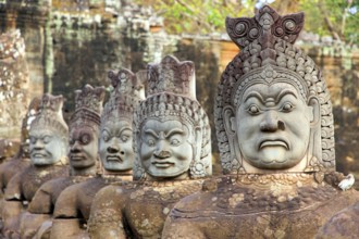 Balustrade with stone gods and demons on the bridge to the southern Tor tor of Angkor Thom