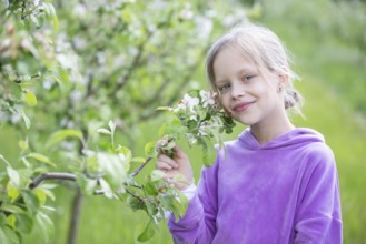 May 27, 2021. Belarus, Gomel, Public event.A beautiful little blonde woman poses in a spring garden