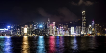 HONG KONG, CHINA - SEPTEMBER 27 2024: Night time view of Hong Kong Island and Victoria Harbour from