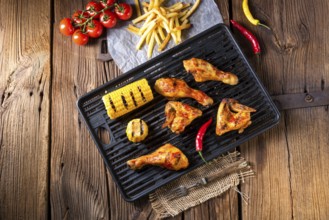 Rustic Grilled chicken wings, legs, and spicy corn