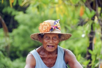 Portrait of a balinese old woman looking at camera