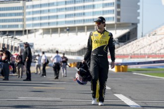 NASCAR XFINITY Driver Josh Bilicki (07) walks pit road before practice for the Drive for the Cure