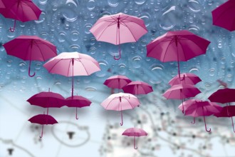 Many stretched pink raindrops float in front of a background with large raindrops and a weather map