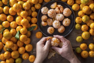 Presentation of Small peeled mandarin oranges on old wooden table