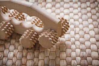 Close up image of wooden relaxing massager on wicker background healthcare concept