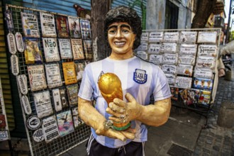 Statue of Diego Maradonna with football World Cup trophy in La Boca, Buenos Aires, Argentina