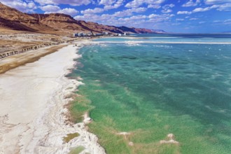 Magnificent Dead Sea. Drone footage. Bright March day. The water reflects the bright blue of the