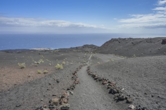 Hiking trail in the lava field at Volcan de Teneguia, Fuencaliente, La Palma, Spain