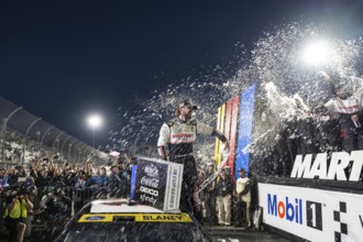 NASCAR Cup Series driver, RYAN BLANEY (12) of High Point, NC, celebrates his win for the Xfinity