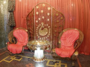 Nice metal delicate forged furniture in oriental style, peacock theme prevailing: two armchairs,