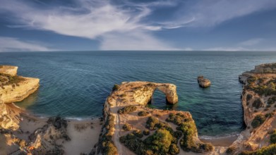 Praia de Estaquinha, Portuguese coast near the city of Lagos in the light of the setting sun