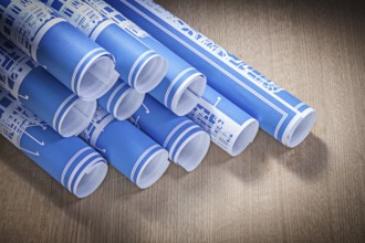Blue engineering drawings on wooden board construction concept