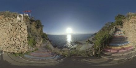 360 photo - Colourful stairs leading down the rocky coast from the hotel area. Waterside scene with
