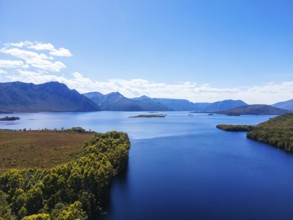 Lake Burbury and surrounding mountain landscape on a warm summer's aftenoon near Queenstown in