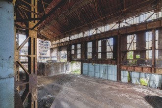 Abandoned industrial building with rusted metal structures and large, broken windows, HF6, Lost