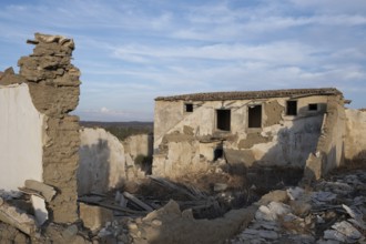 Abandoned and collapsing farm house outdoor. Clay traditional architecture ruins. Deserted places
