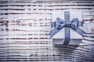 Present box on vintage wooden board holidays concept