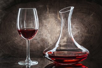 Wineglasss And Decanter With Red Wine On Vintage Wood Background