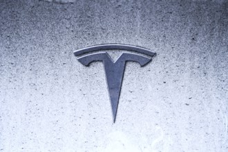 Tesla logo on an electric car