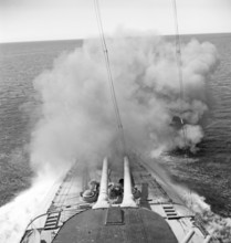 During World war II. The war ship Sverige during navy exercises at sea. The front cannons being