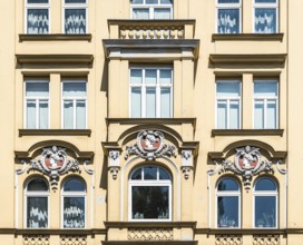 Munich, Bavaria - Germany - 07 29 2018 Detail of a historical yellow facade with ornaments