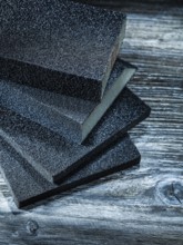 Polishing sanding blocks on vintage wooden board