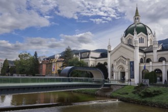 Festina Lente Bridge, pedestrian bridge over the Miljacka River, bridge with a loop, on the right