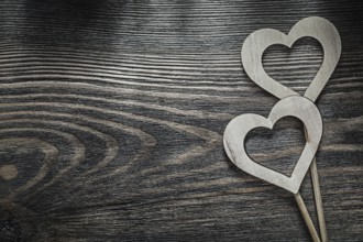 White wooden hearts on wood board holidays concept