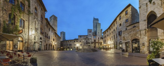 Panoramic view of famous Piazza della Cisterna in the historic town of San Gimignano on a morning,
