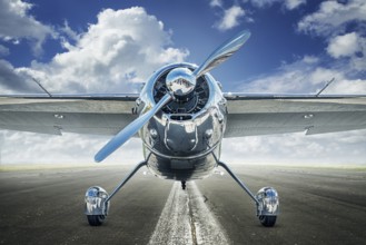 historical airplane on a runway is waiting for take off