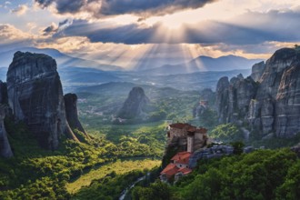 Sunset view over nunnery of Moni Agias Varvaras Roussanou and beautiful massive rocky pillars of