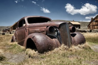 Rusty car wreck in the abandoned gold mining town of Bodie, USA