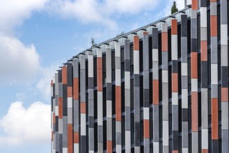 Low angle view of modern office building against sky
