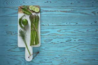 Healthy food vegetables for heart heath on wooden turquoise background