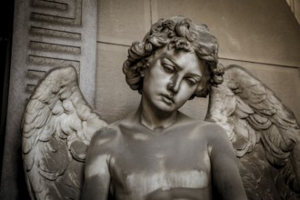 GENOA, ITALY, June 2020: antique statue of angel (beginning 1900, marble) in a Christian Catholic